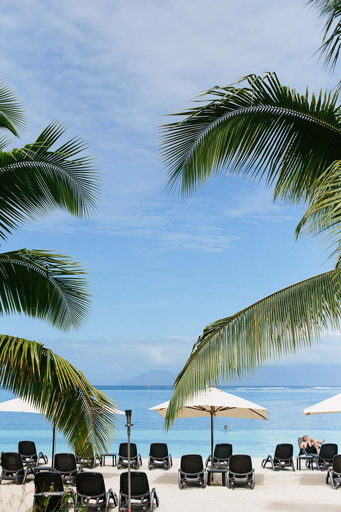 Infinity pool into a blue sky at a resort in Tahiti