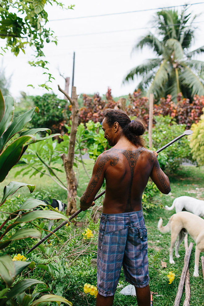 Tattoos on a local Tahitian man's back represent his life