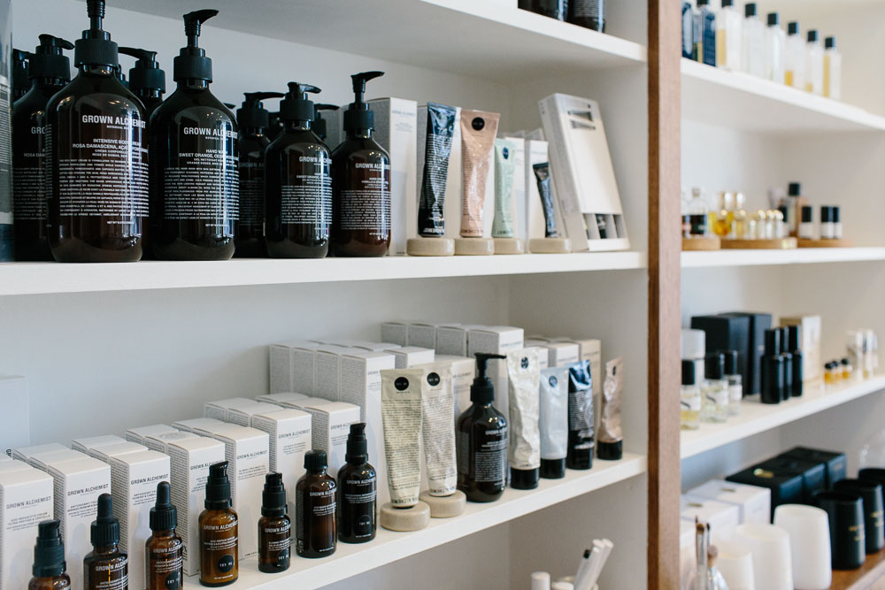 Beauty products beautifully displayed on white shelves