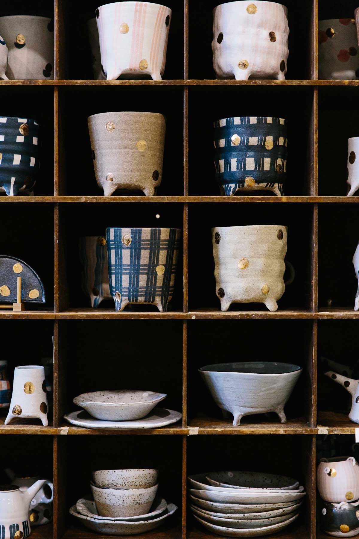 Ceramics by Bridget Bodenham on wooden shelving