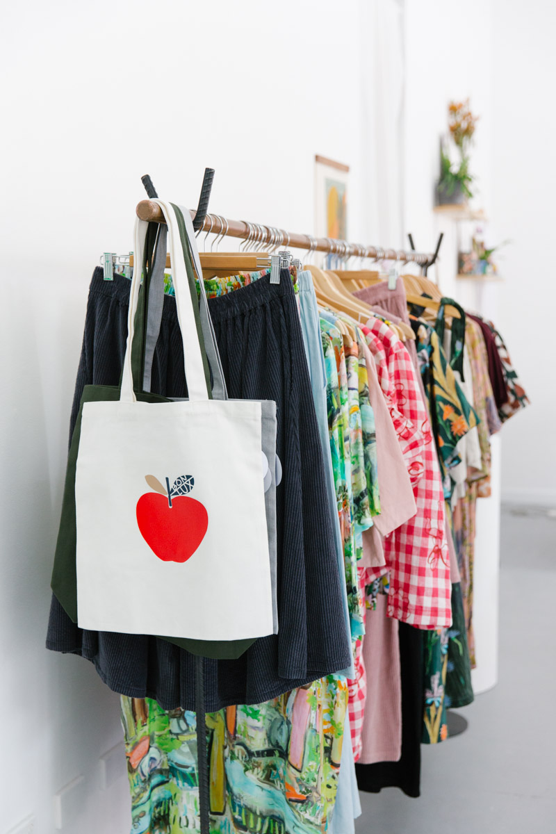 Screenprinted tote bag with bright red apple on the front by Melbourne brand Bon Luxe