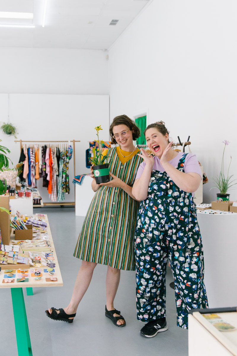 An excitable portrait of Esther and Nat at PALS Pop Up shop