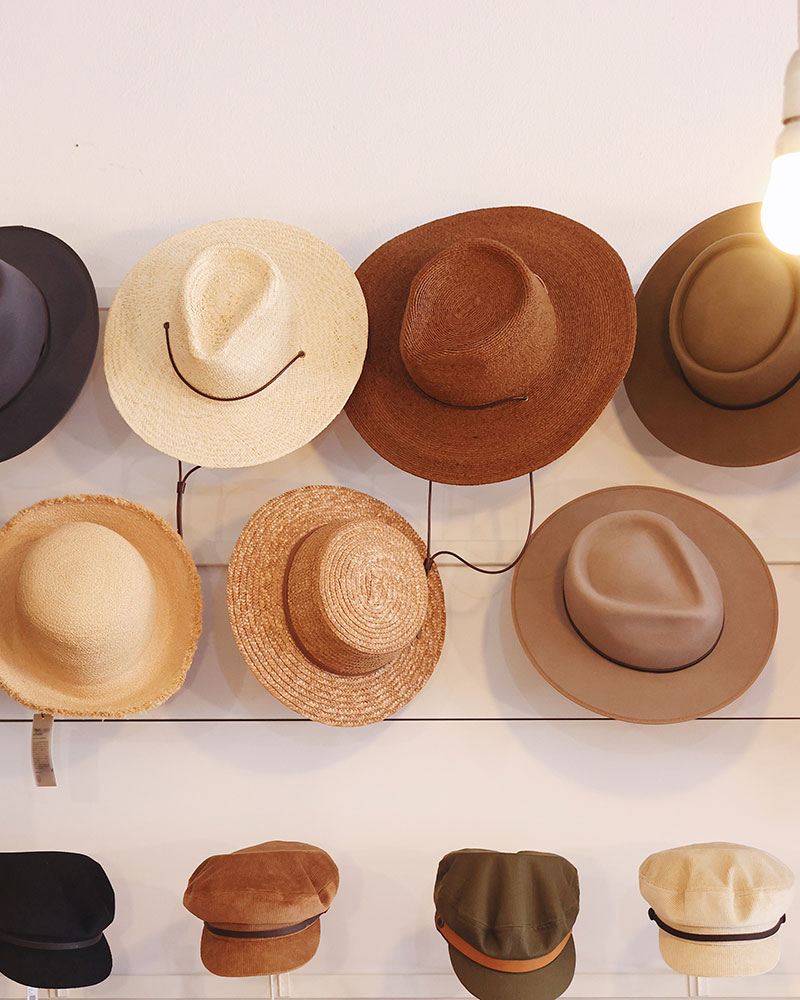 Hats by Will and Bear hang on display in A Quirk of Fate brick and mortar store in Northcote Melbourne