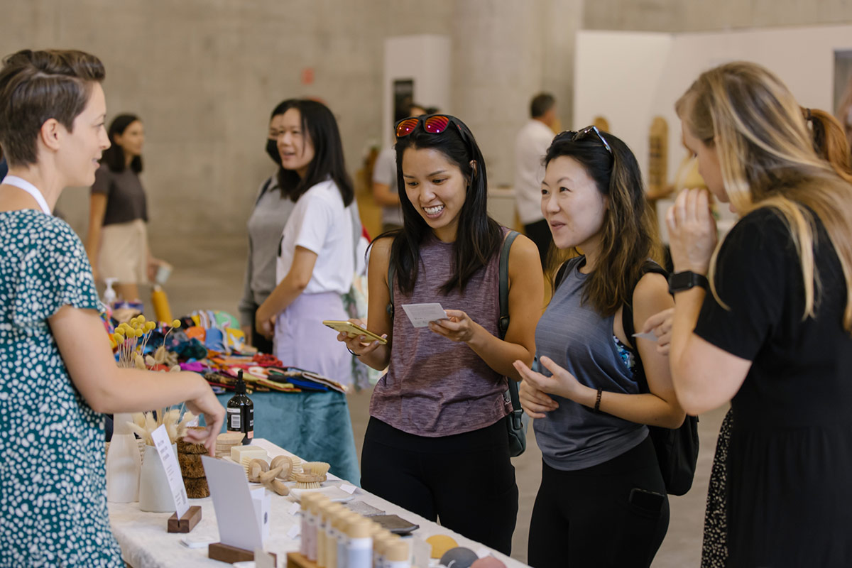 Shoppers browse low waste products at The Conscious Space market event Sydney
