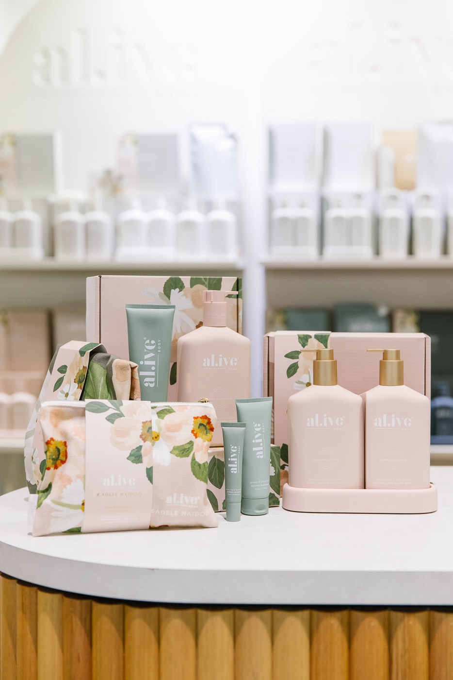 Alive Skincare on display in pastel pinks and sage greens