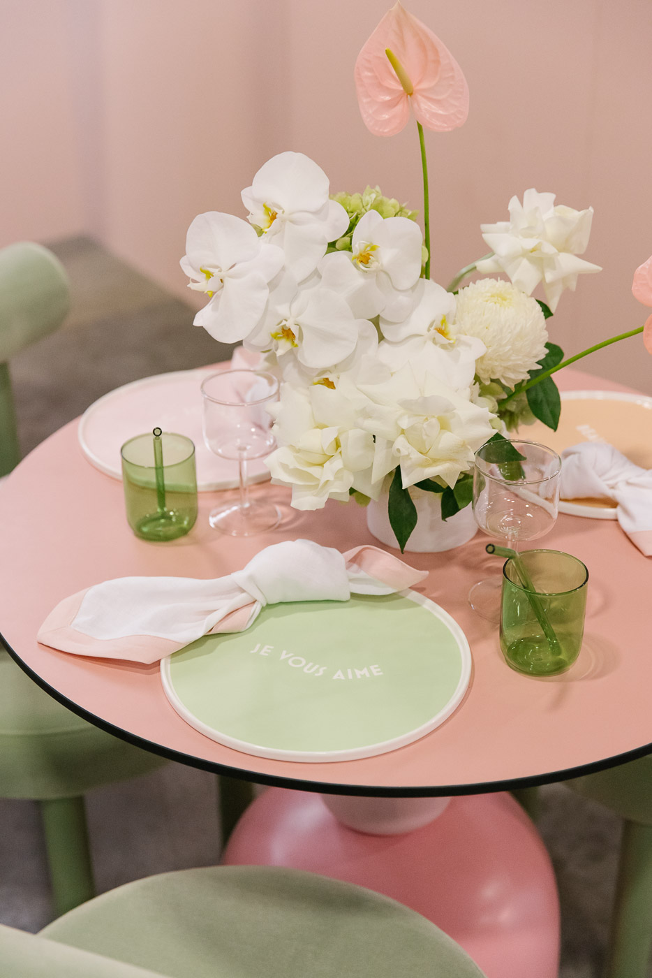 Close up of ceramic tableware in pastel pinks and mint greens