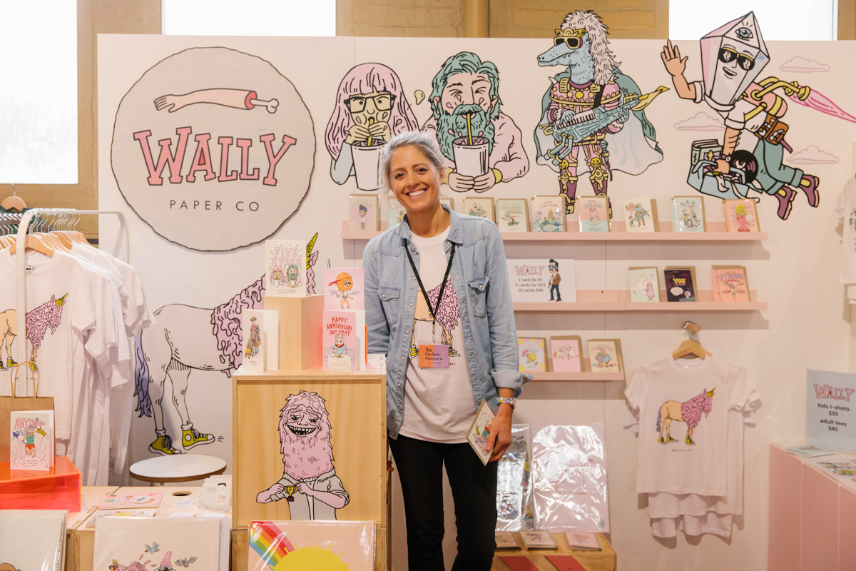 Designer of Wally Paper Co poses for a portrait in front of their stall