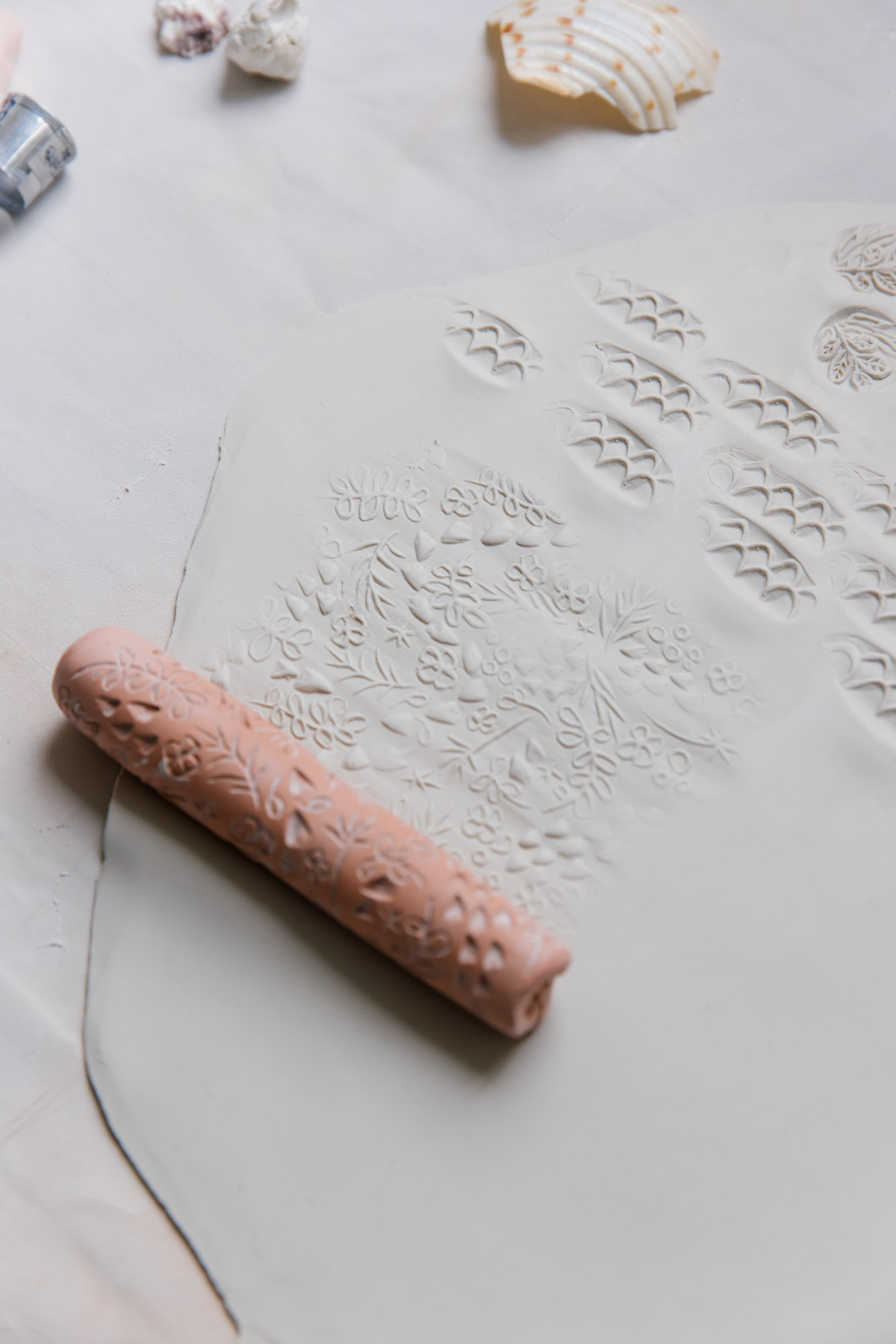 Making patterns on clay using a handmade stamp