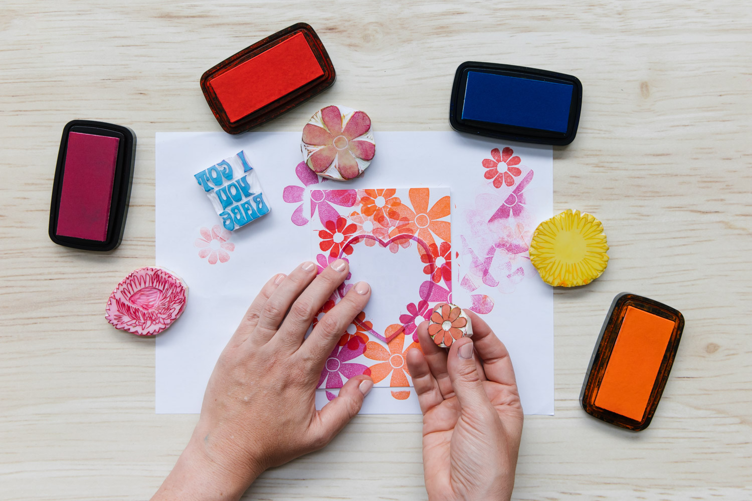 Block printing by hand using stamp inks to create a gift card design