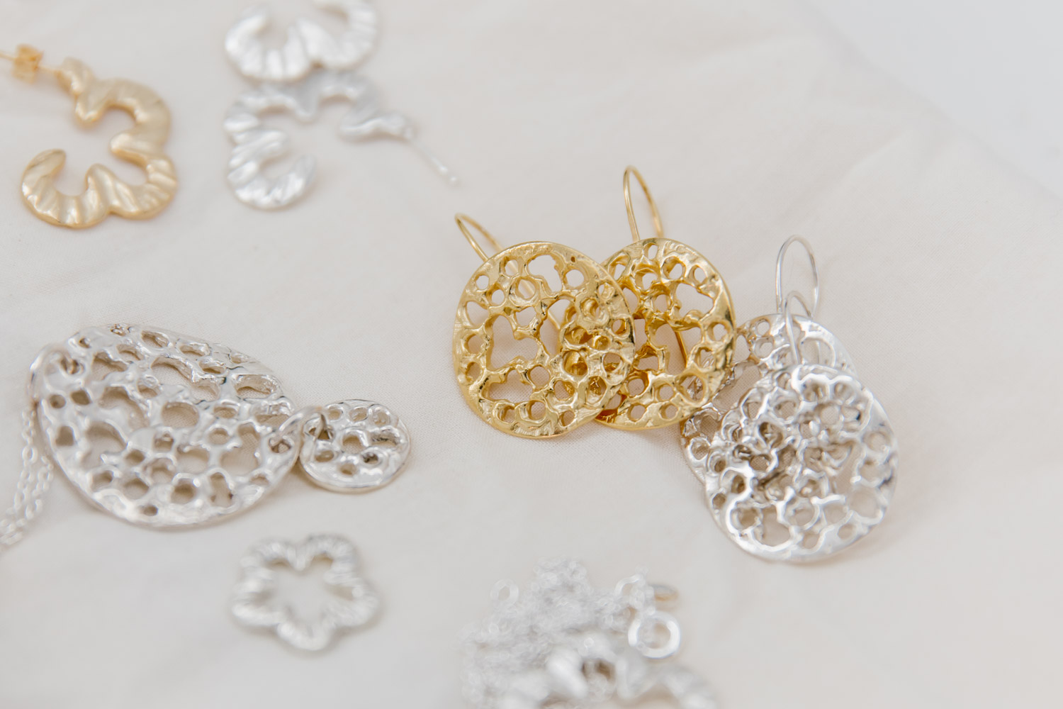 Organic earring designs created by Jane Jones Jewellery in silver and gold