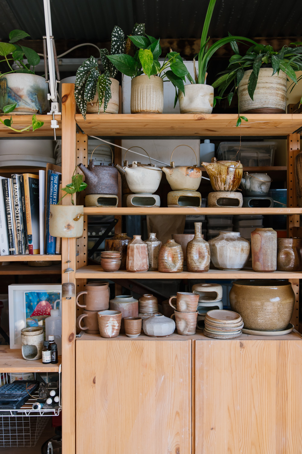 Ceramics studio shelves filled with unique works by Emi Ceramics