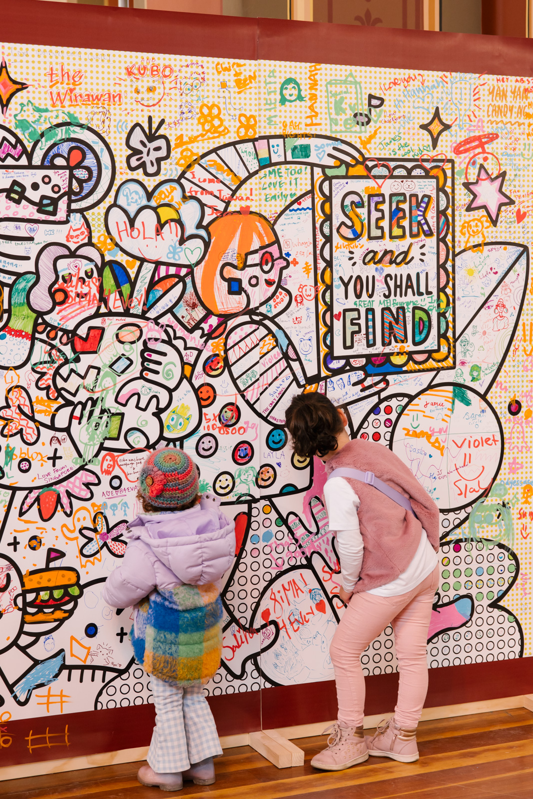 Kids colour-in an interactive mural at The Finders Keepers Market by Yanyan Candy Ng