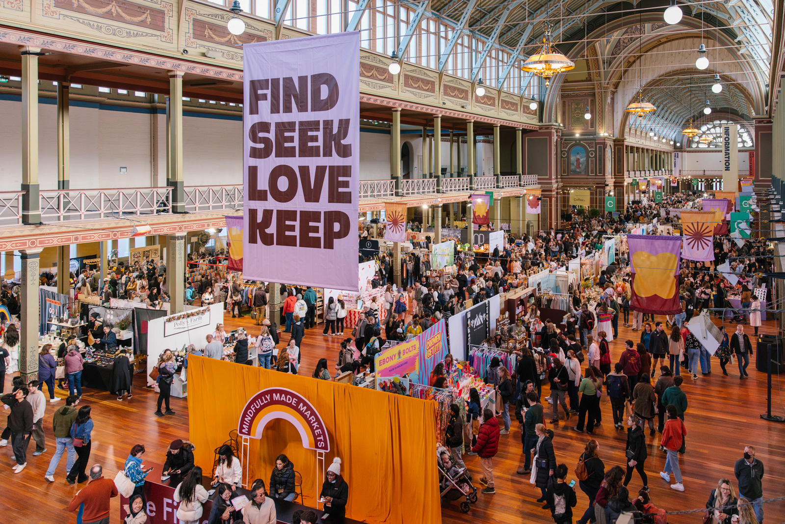 Find Seek Love Keep signage hangs above the crowd at The Finders Keepers Market at the Royal Exhibition Building Melbourne